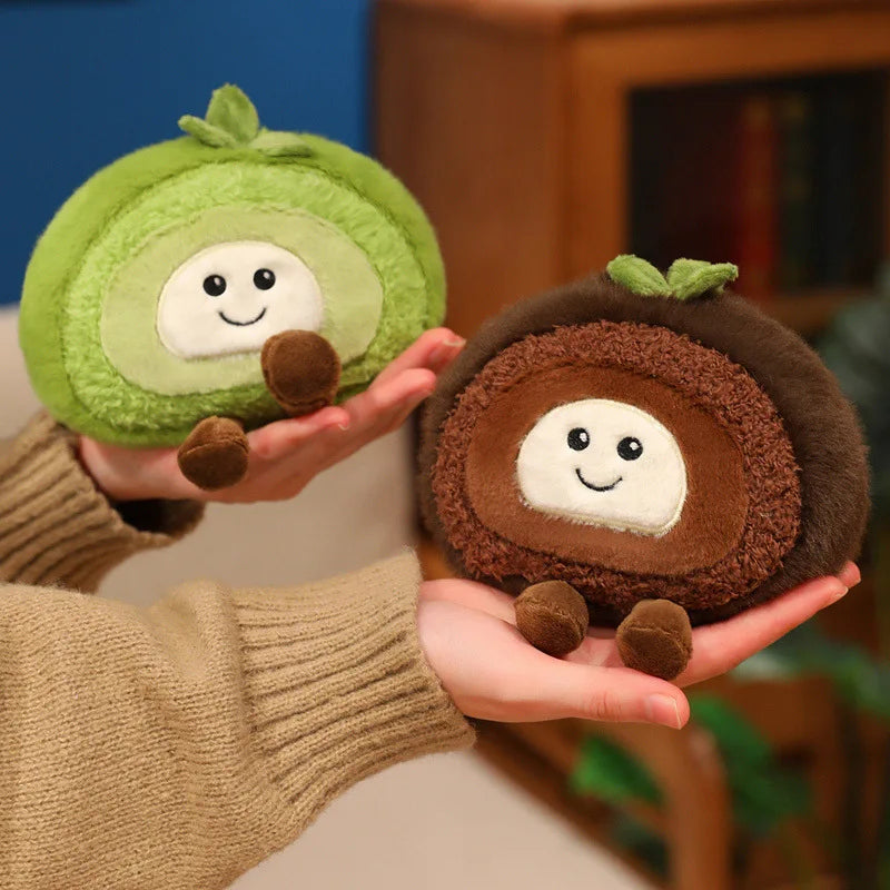 Two kawaii plush avocado toys held in hands with a blurred indoor background