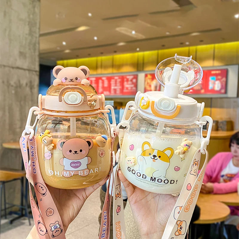 Two cute kawaii water bottles with animal-themed designs held by a person in a casual setting.