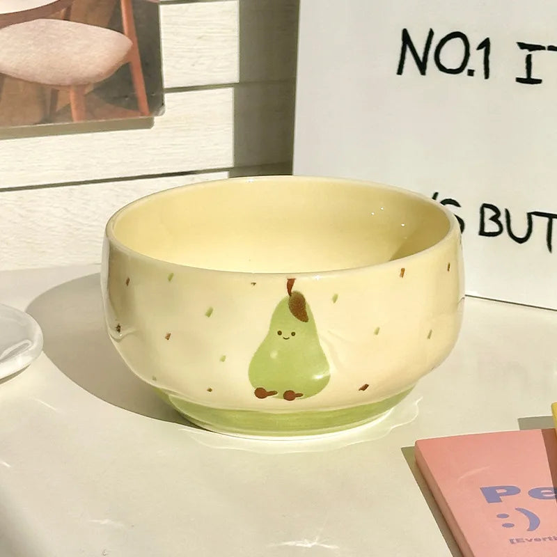 A kawaii bowl with a pear design on it