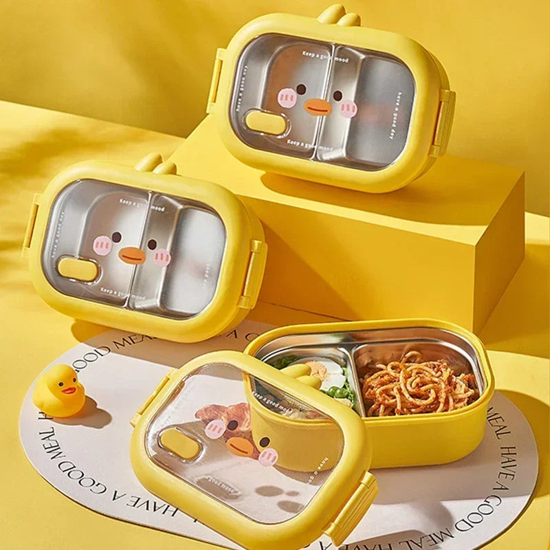 Yellow kawaii cartoon-themed bento box with compartments on a yellow background