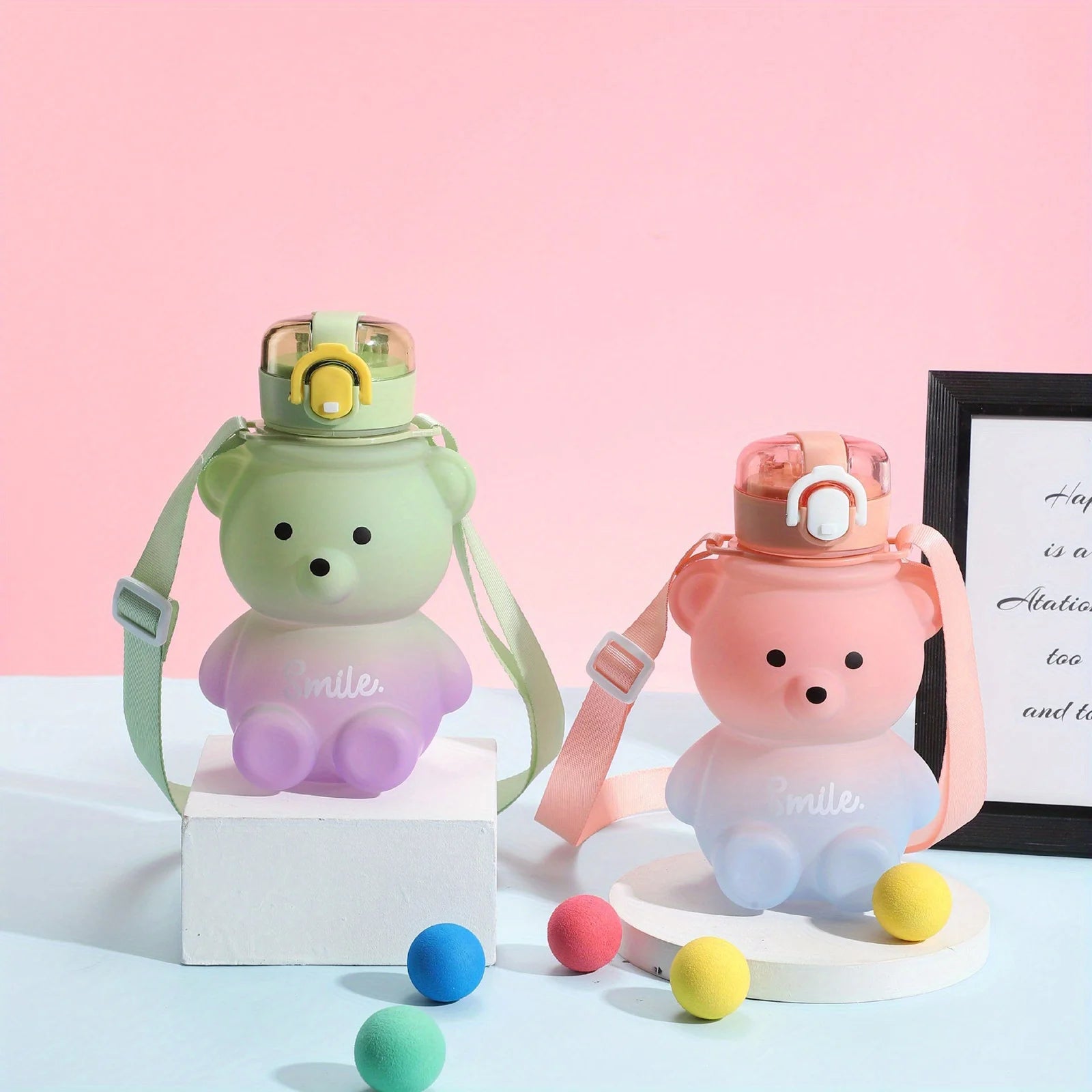 Two bear-shaped kawaii water bottles with colorful caps on a light pink background