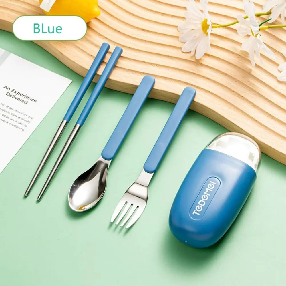 A set of steel and blue kawaii utensils on a table