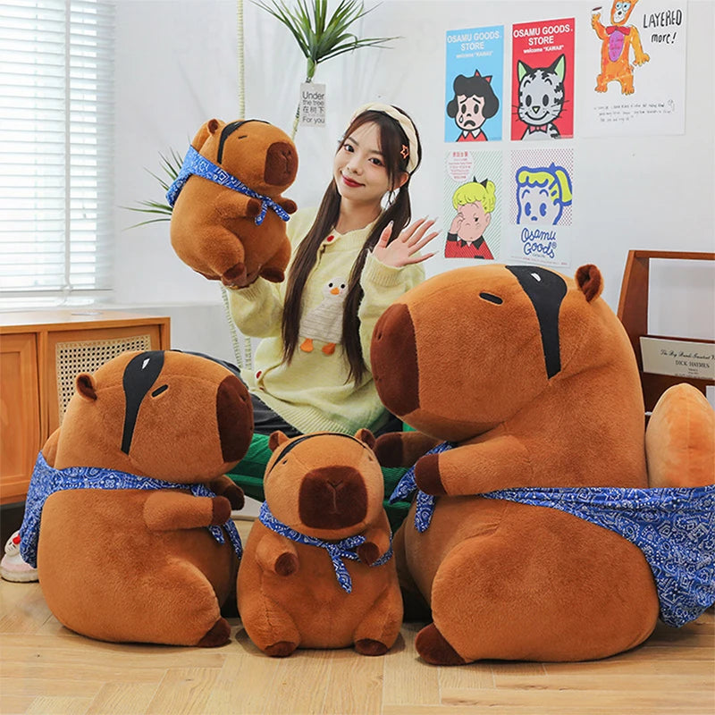 Woman with large brown kawaii plush animals in a room with posters on the wall