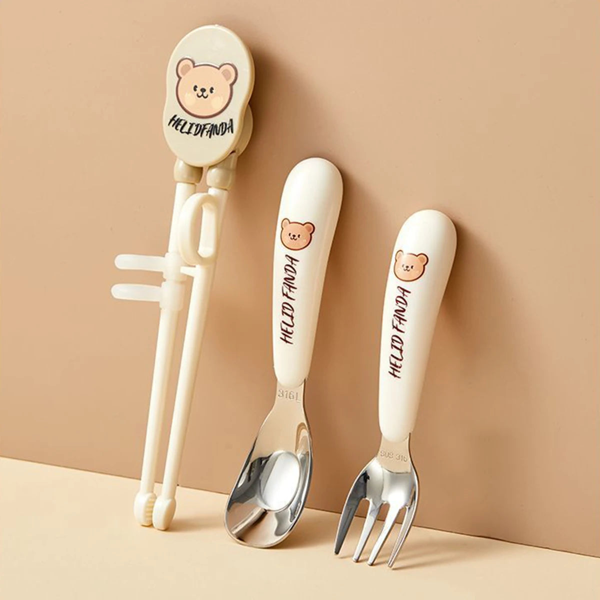 Children's kawaii utensils set with bear handles and 'HELLO FANDA' branding on a beige background