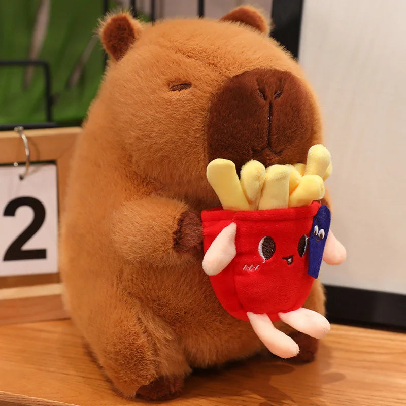 Kawaii plush toy resembling a bear holding a red bag of fries on a wooden surface.