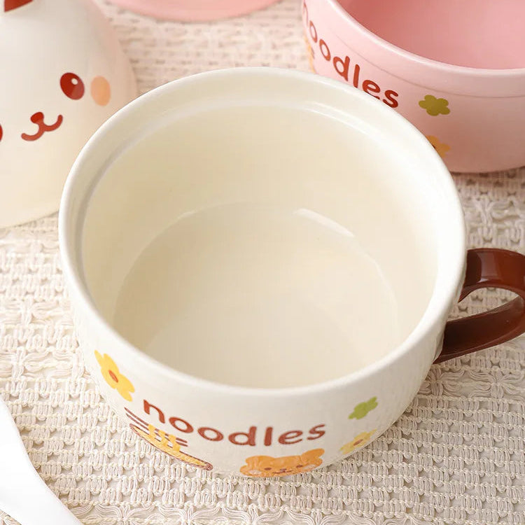 Ceramic kawaii ramen bowl with cartoon face design on a textured surface