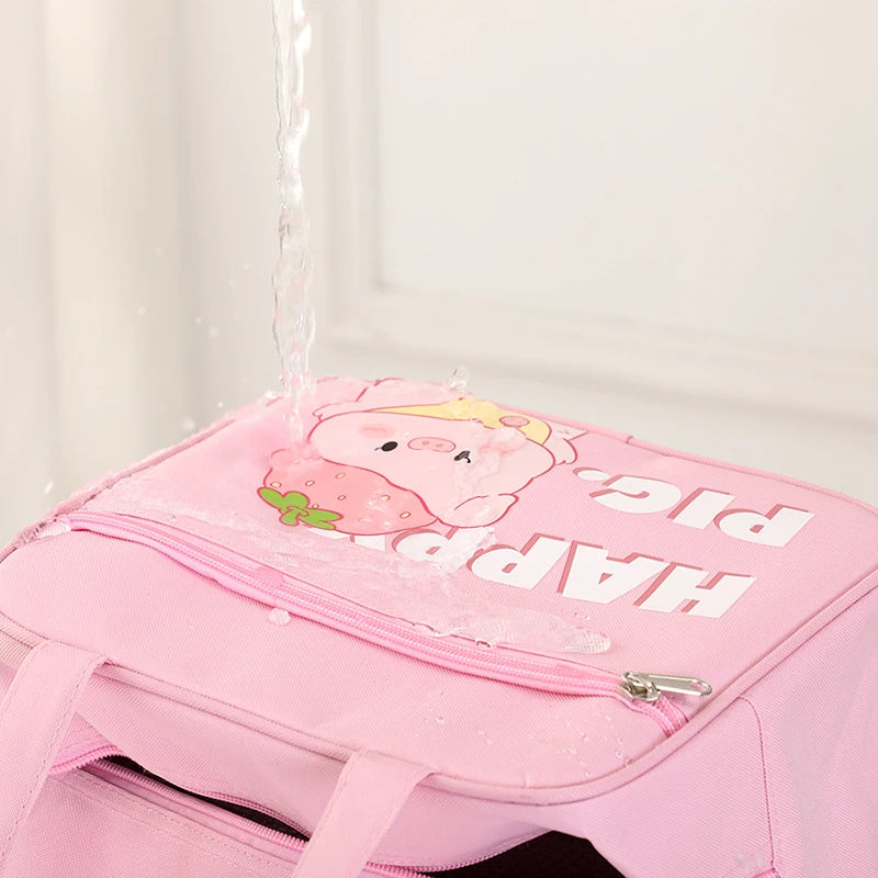 Pink kawaii bag with cartoon pig design and text on a white background