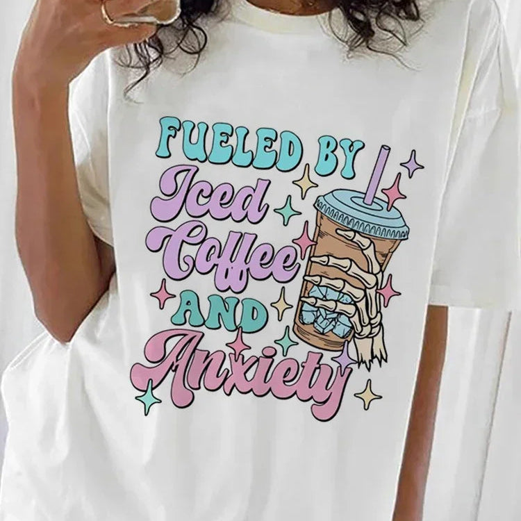 White t-shirt with kawaii colorful graphic and text worn by a person.