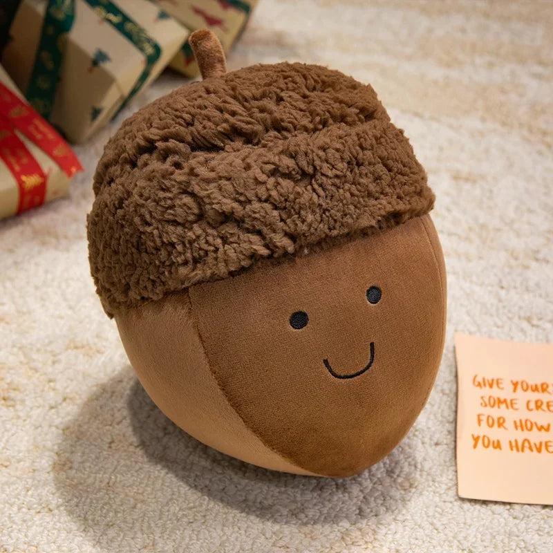 Kawaii plush acorn toy with a smiling face on a textured surface