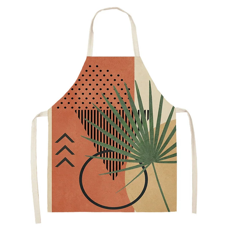 Kawaii apron with geometric patterns and a palm leaf design on a white background