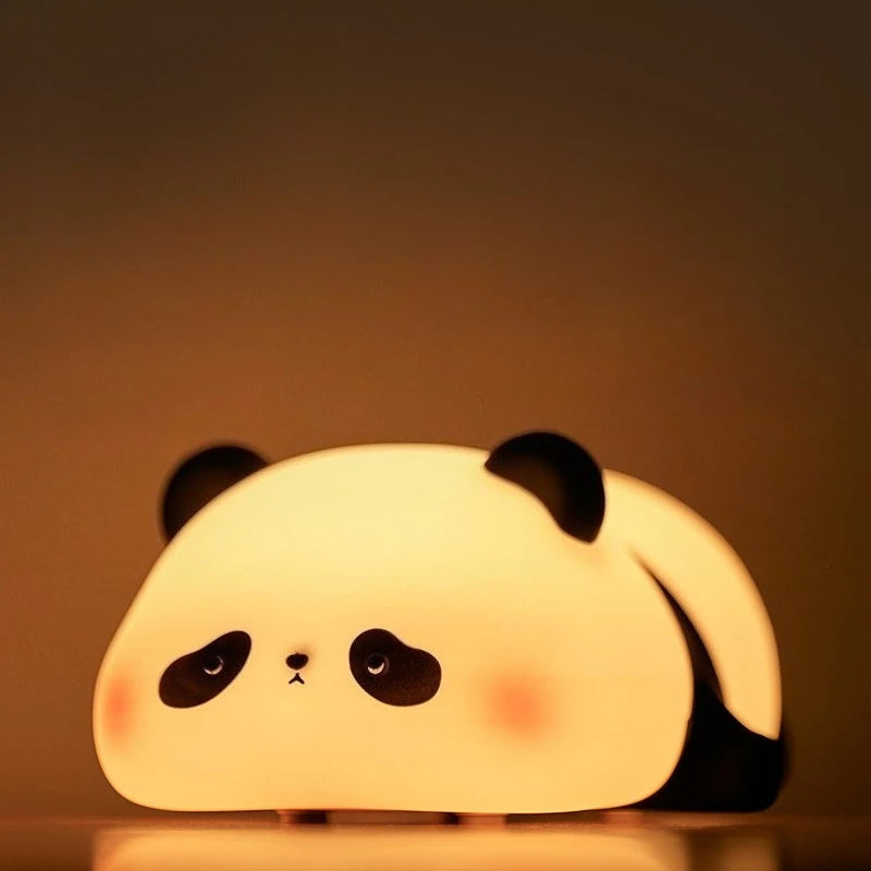 Panda-shaped kawaii night light on a dark background