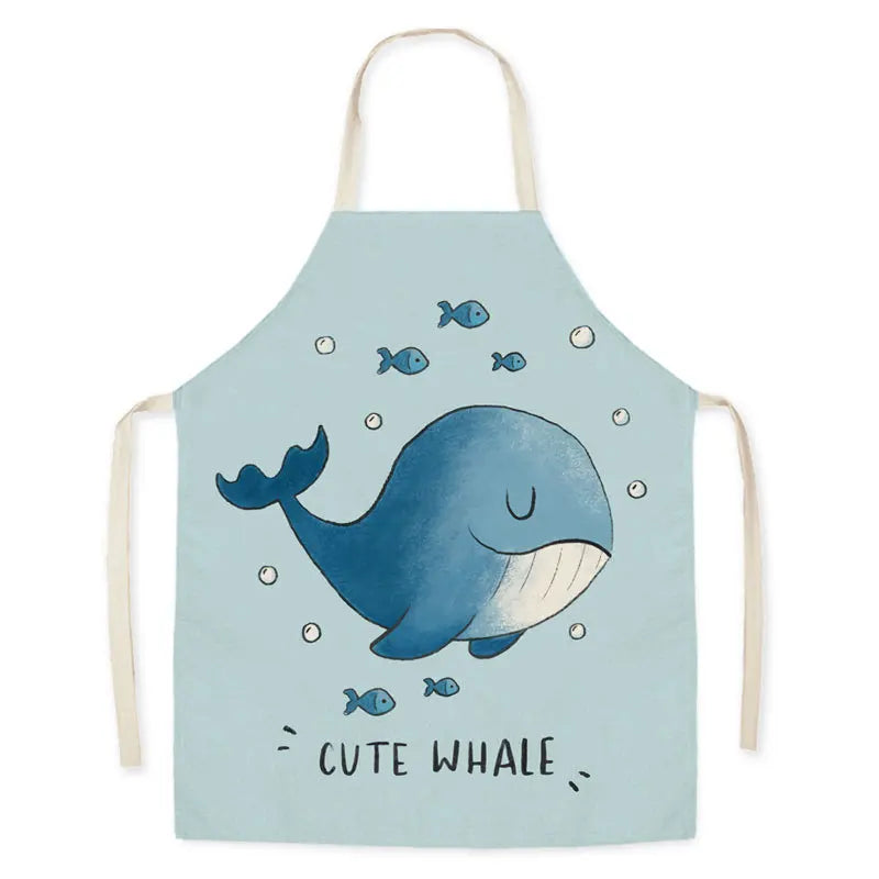 Children's kawaii apron with a whale design on a light blue background