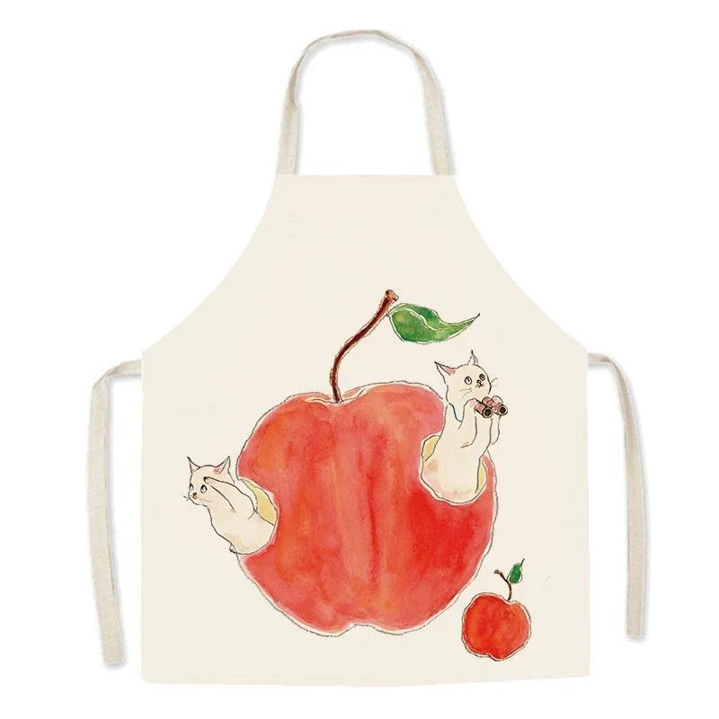 Kawaii apron with a design of a red apple and two cats on a white background