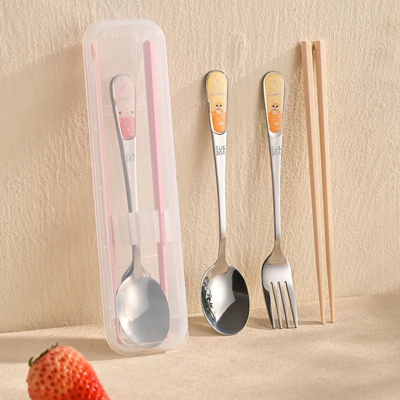 A pink and steel kawaii utensils set up against the wall