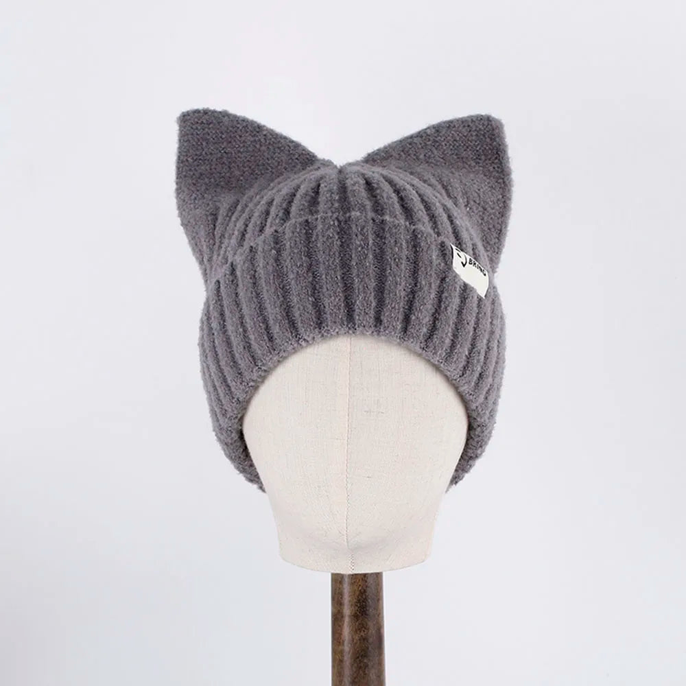 Gray knit Kawaii beanie with cat ears on a mannequin head against a white background