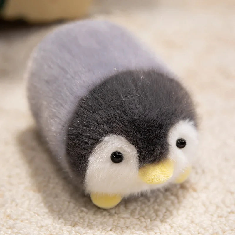 Kawaii plush toy penguin on a beige surface