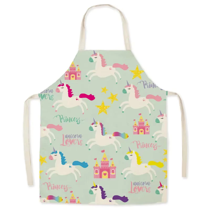 Children's kawaii apron with unicorn and castle pattern on a light green background