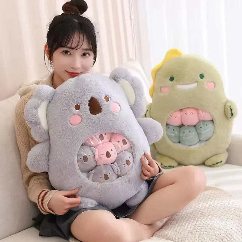 Person holding a large gray kawaii plush toy with a smiling face, sitting on a couch.