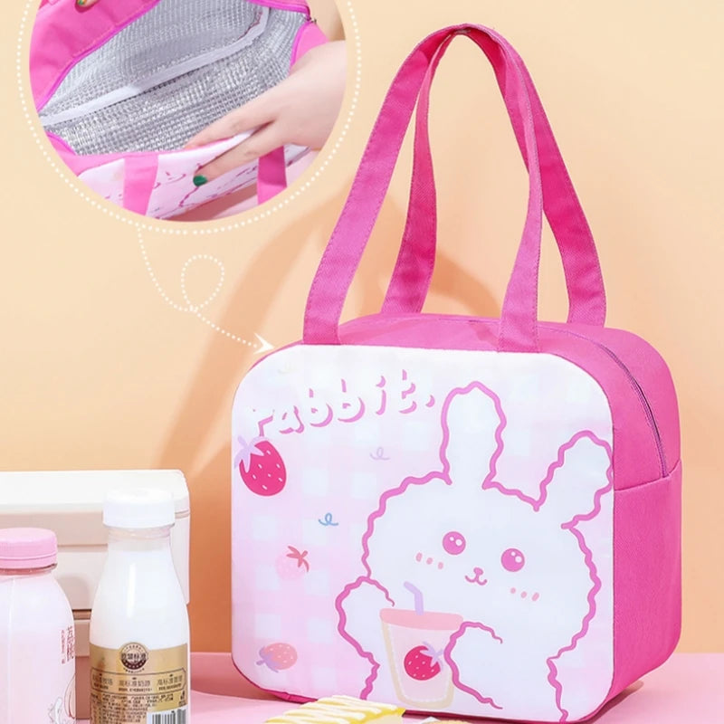 Pink kawaii lunch bag with a cartoon rabbit design on a light pink background