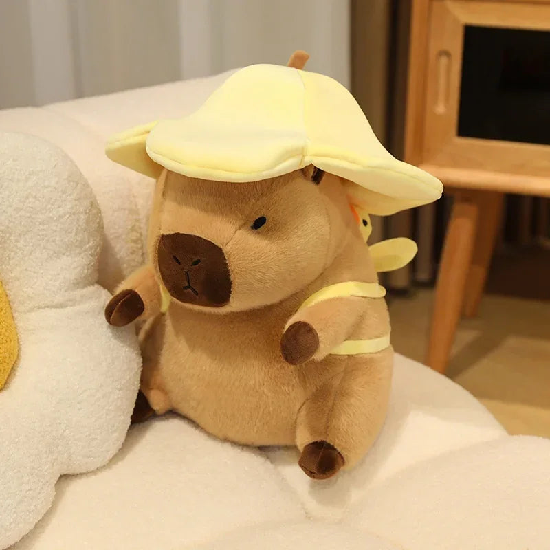 Kawaii plush toy resembling a bee with a yellow hat on a white surface