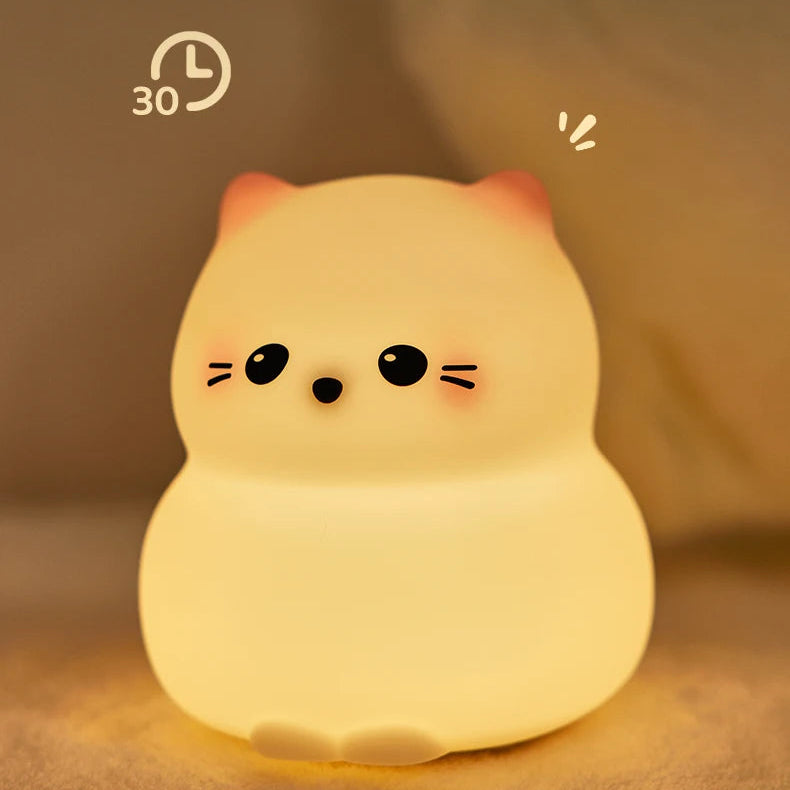 Cute kawaii cat-shaped night light with a warm glow on a soft brown background