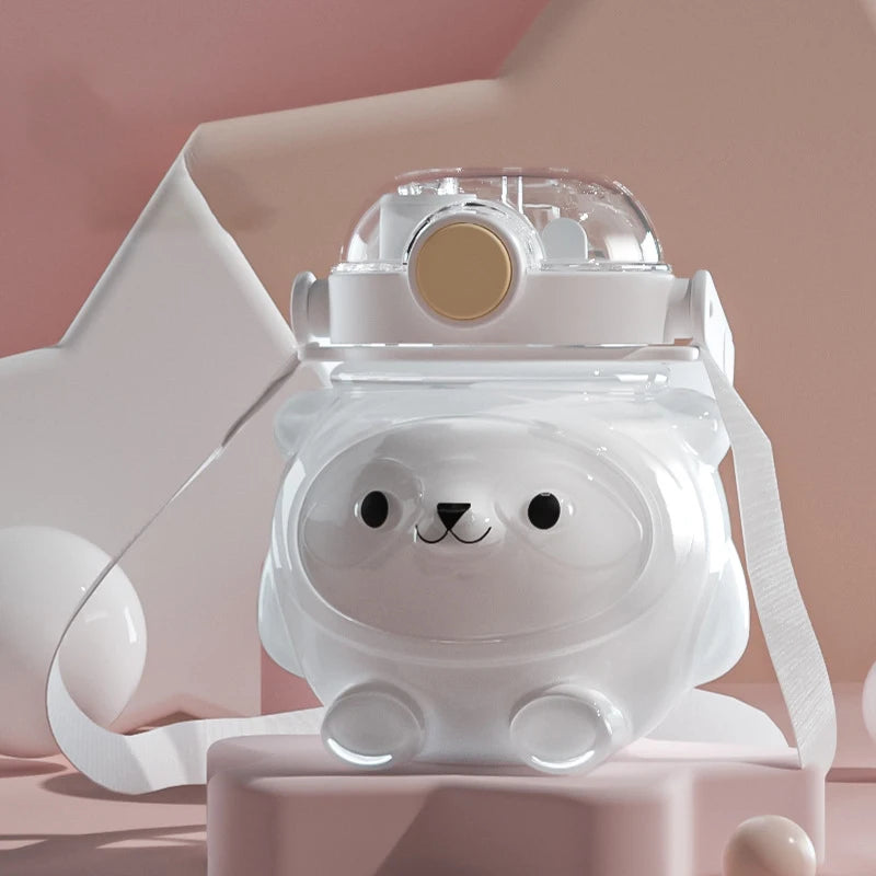 Cute animal-shaped kawaii water bottle on a pink background