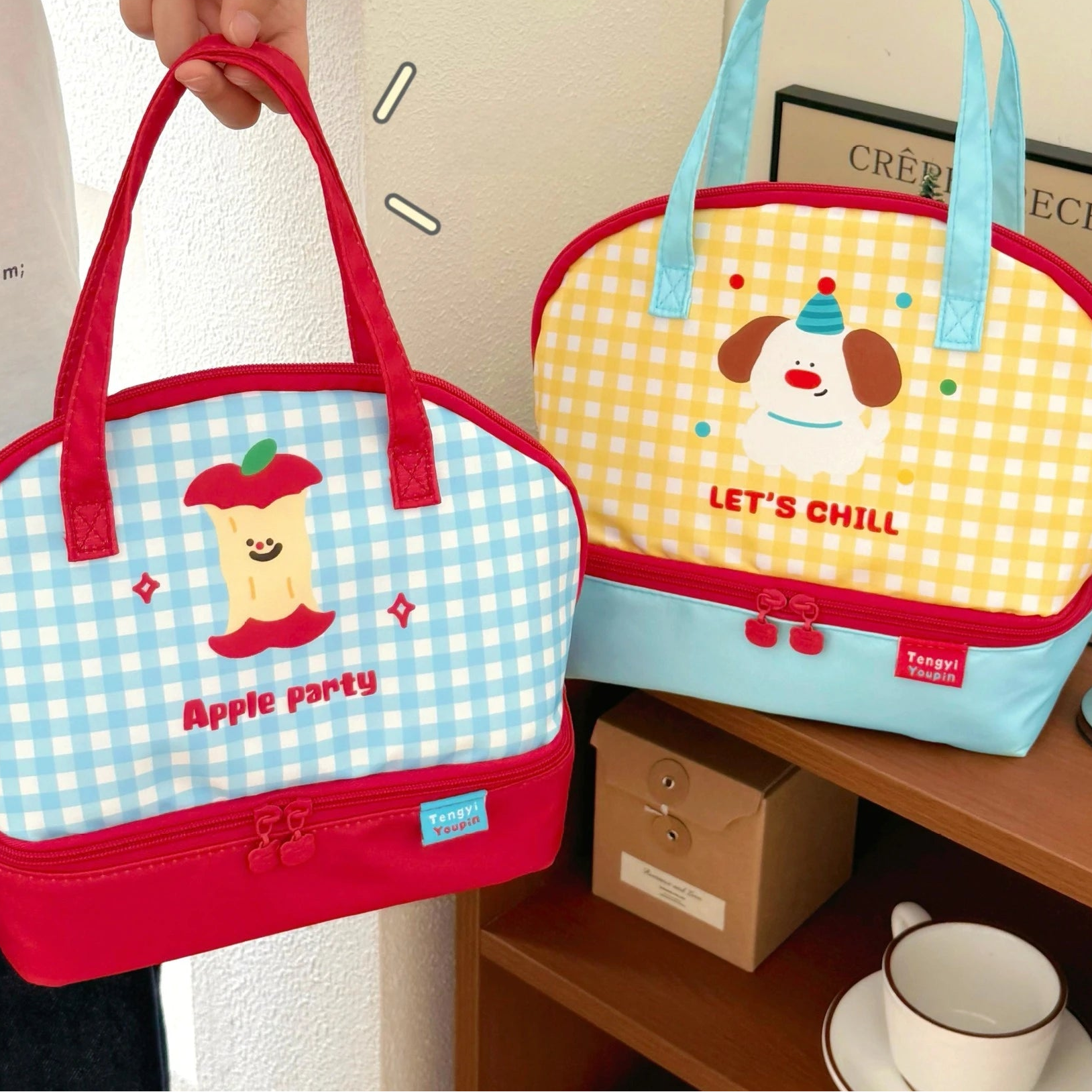 Two cute kawaii bags with cartoon designs on a table.