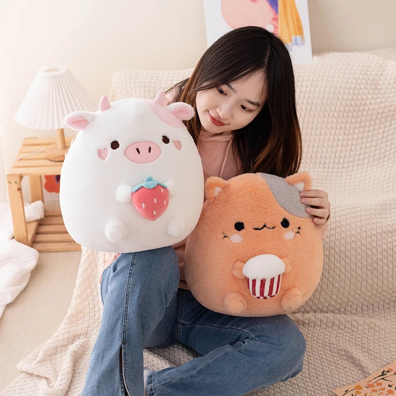 Woman holding two cute kawaii animal-shaped pillows on a couch