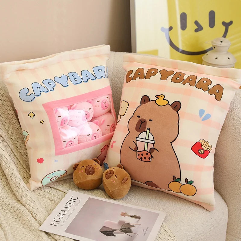 Two kawaii pillows with cartoon bear designs and 'Capybara' text on a couch.