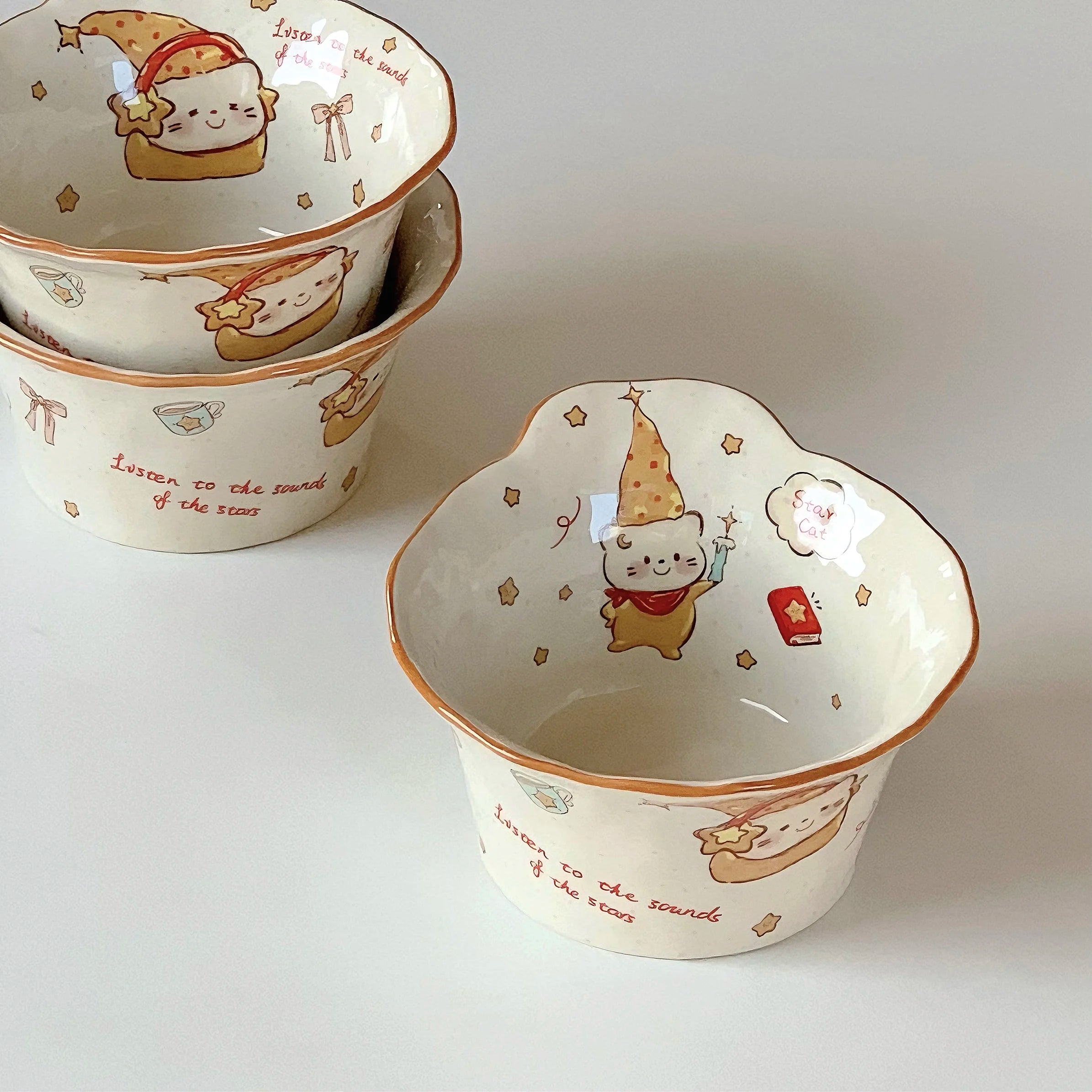 Set of ceramic kawaii ramen bowls with cartoon character design on a white background