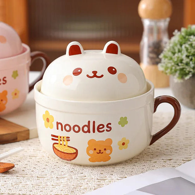 Cute ceramic kawaii ramen bowl with lid featuring animal ears on a table.