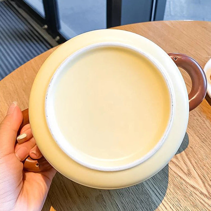 Someone holding a kawaii ramen bowl showing the bottom of it