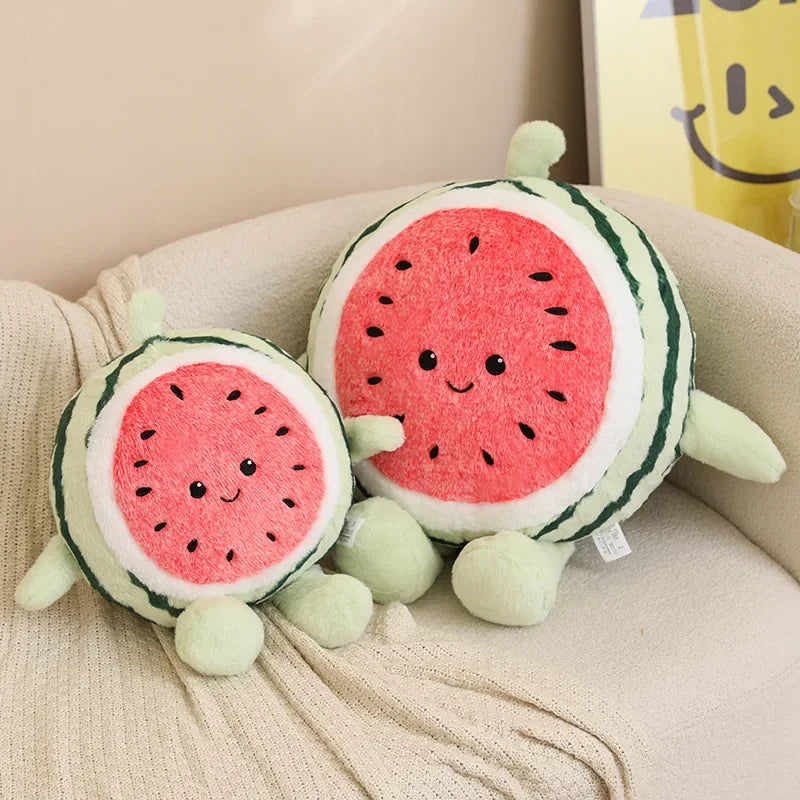 Two kawaii plush watermelon toys on a beige couch