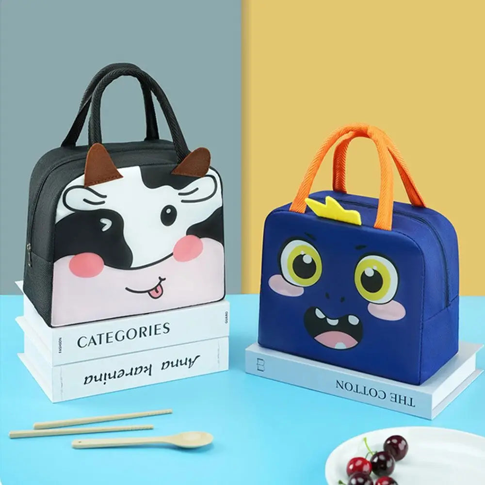 Two cartoon-themed kawaii lunch bags on books with a colorful background