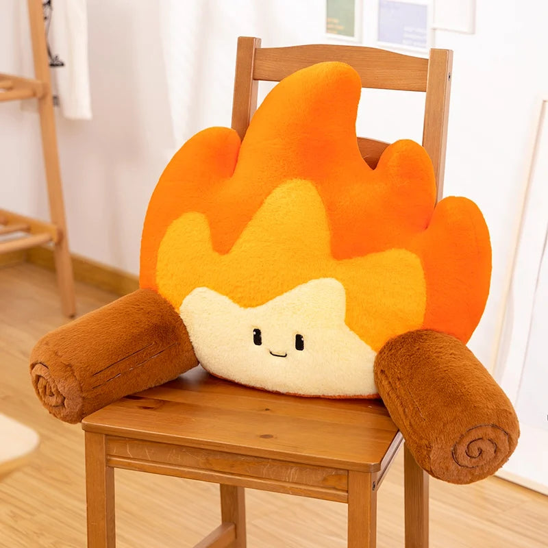 Flame-shaped kawaii cushion with a face on a wooden chair