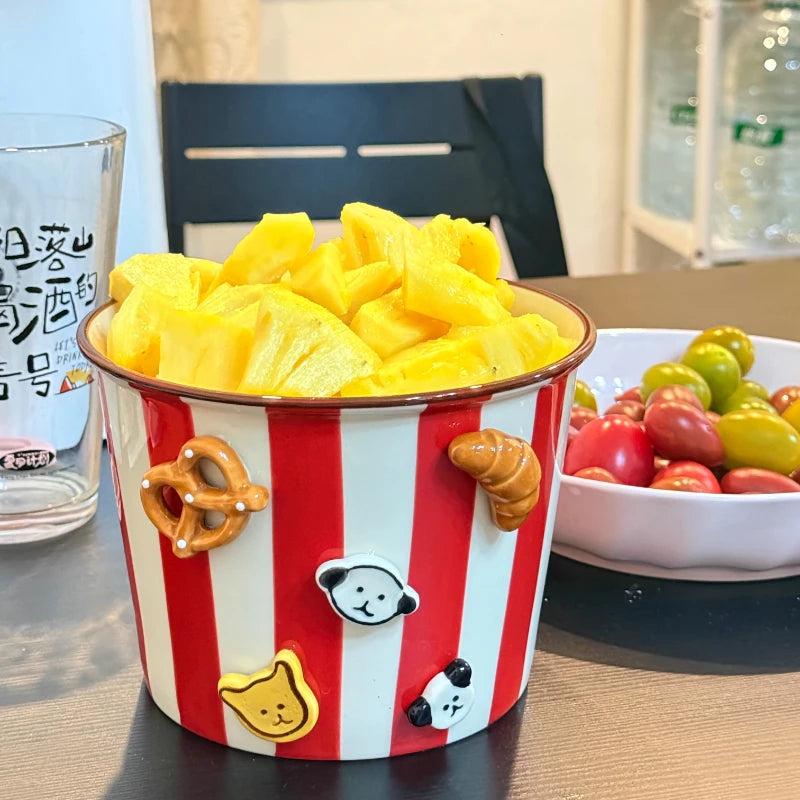 A large red and white kawaii ramen bowl with 3D designs on it