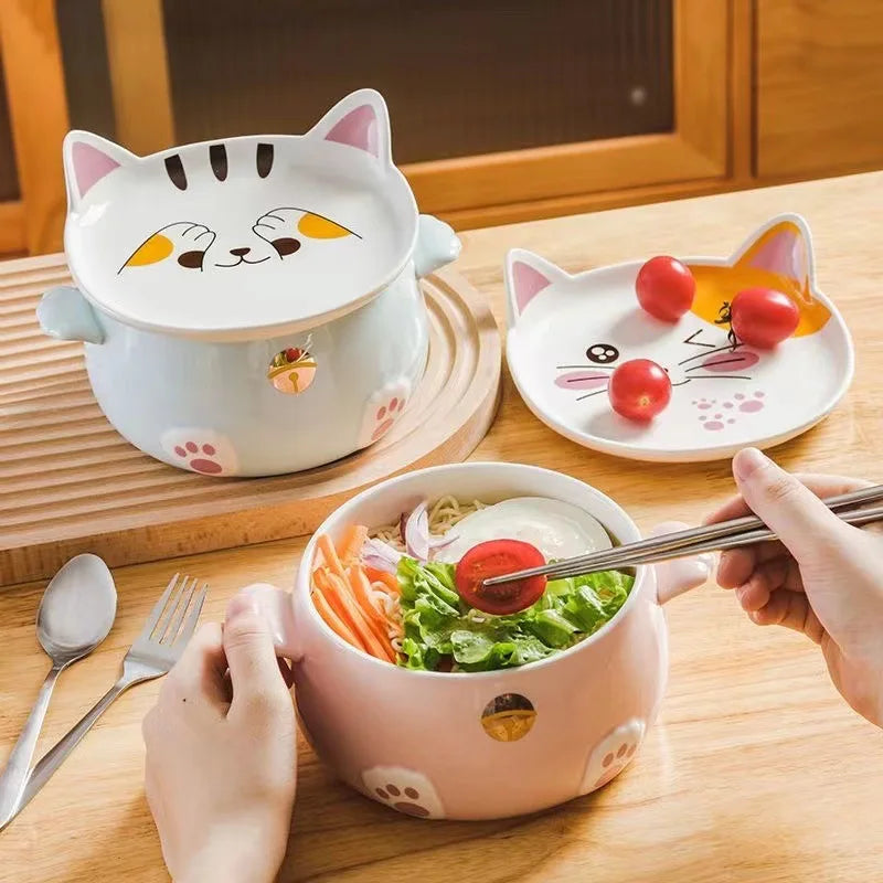 Someone eating from a cat shaped kawaii ramen bowl
