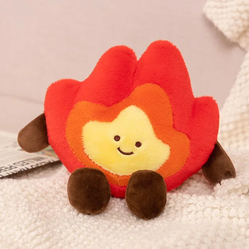 Kawaii plush toy shaped like a smiling fire on a soft surface