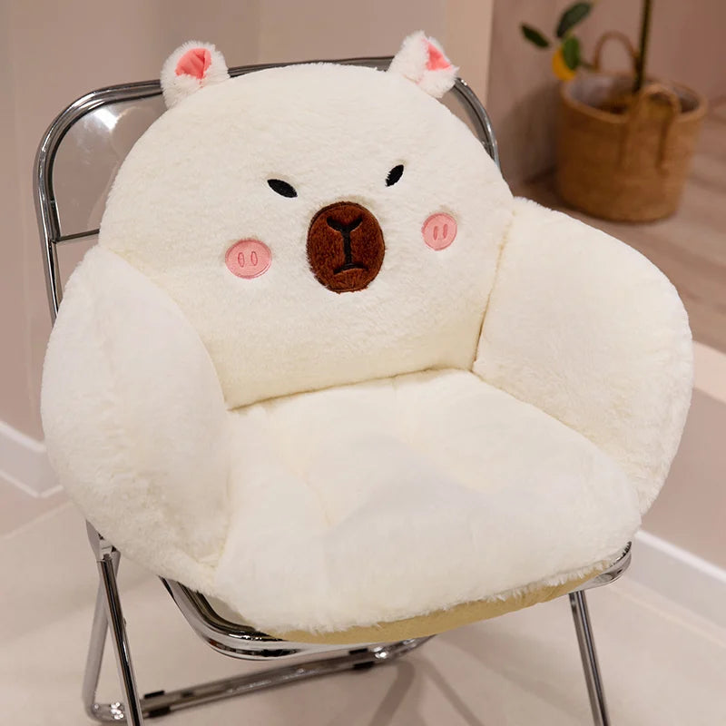 White bear-shaped kawaii cushion on a chair with a neutral background