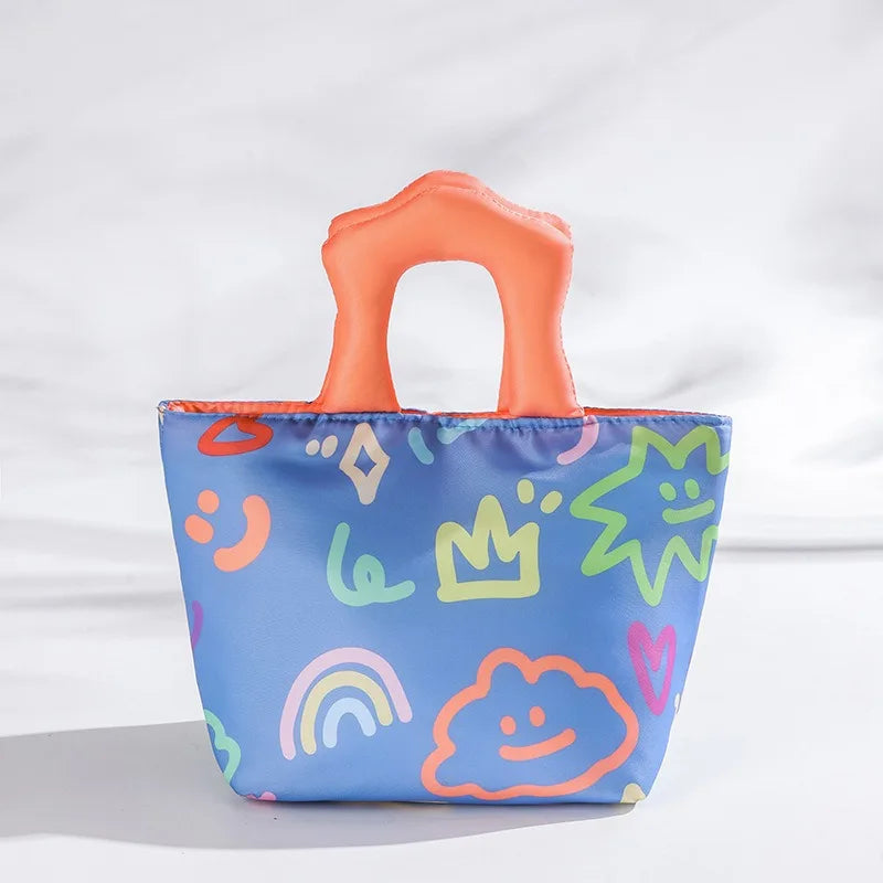 Colorful kawaii tote bag with cartoon designs on a white background