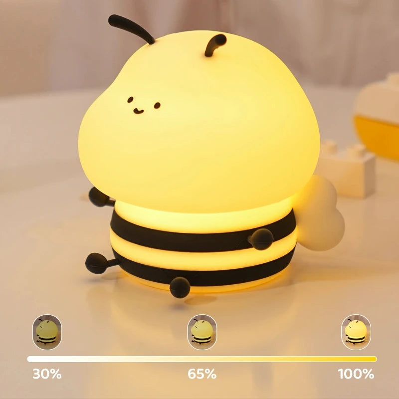 Cute bee-shaped kawaii night light with a gradient of brightness indicators on a neutral background