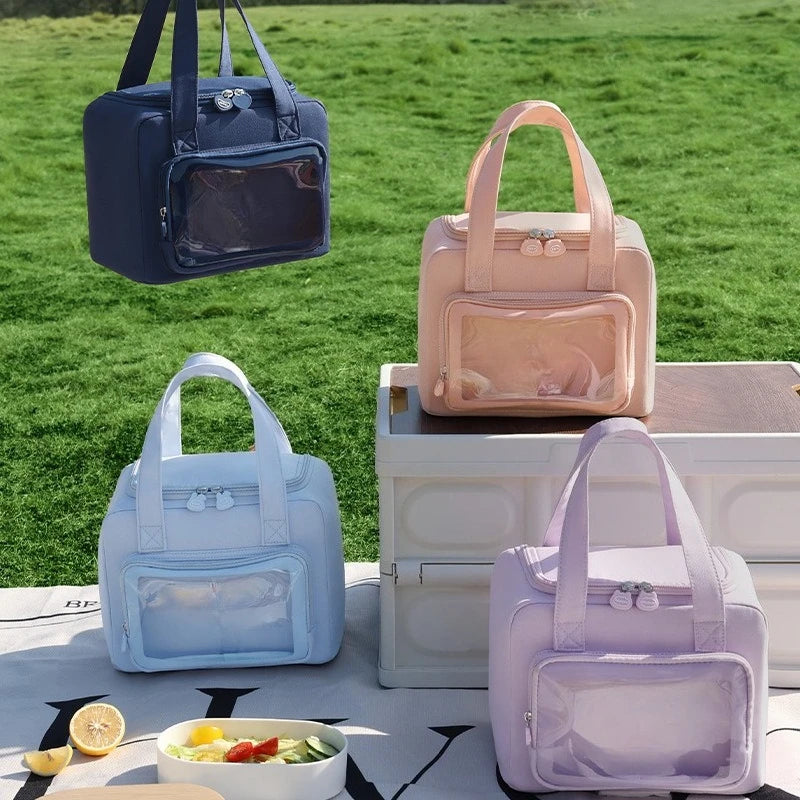 Four kawaii pet carriers in different colors on a grassy background