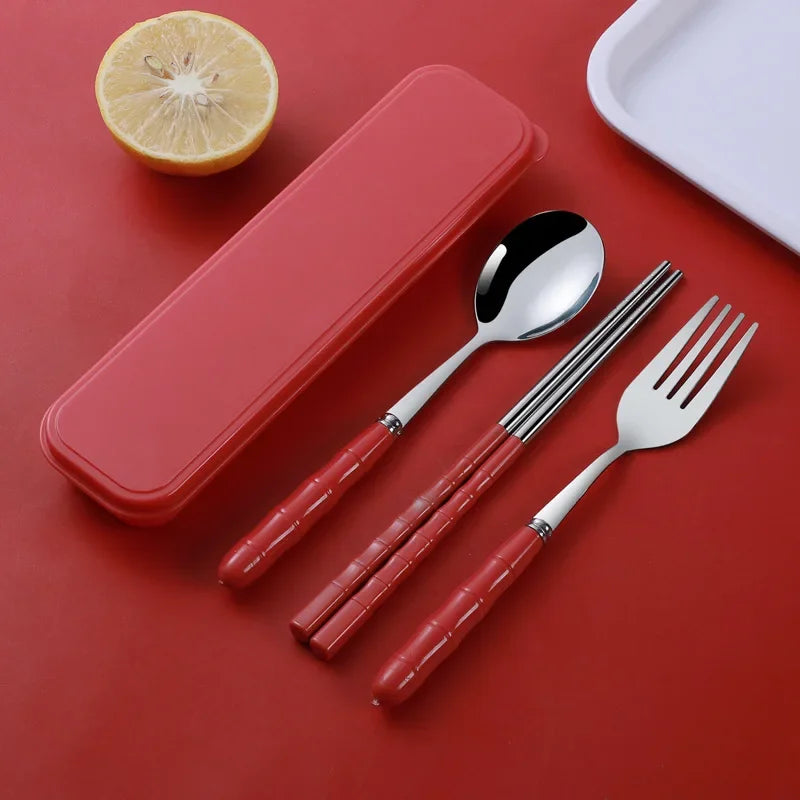 A set of red and steel kawaii utensils on a red background