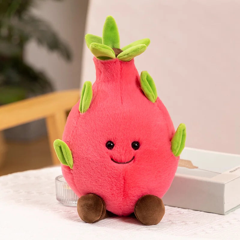 Plush dragon fruit toy with a happy face on a table