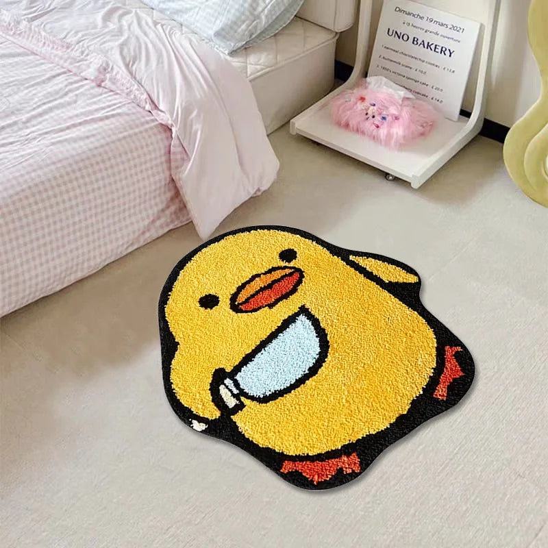 Yellow duck-shaped kawaii rug on a light-colored floor with a bed and chair in the background.