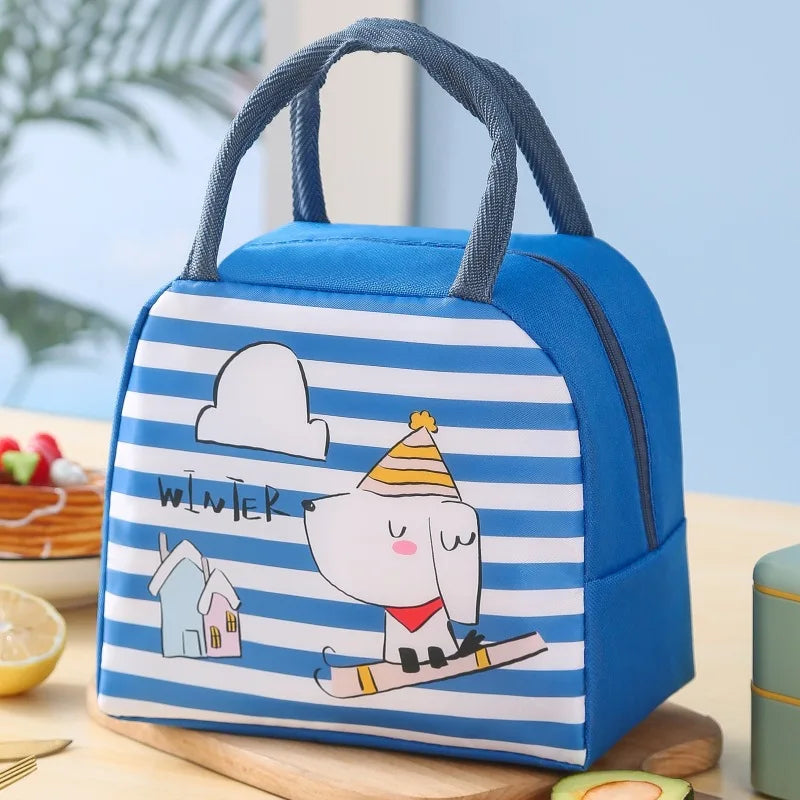Blue and white striped kawaii lunch bag with cartoon design on a wooden surface