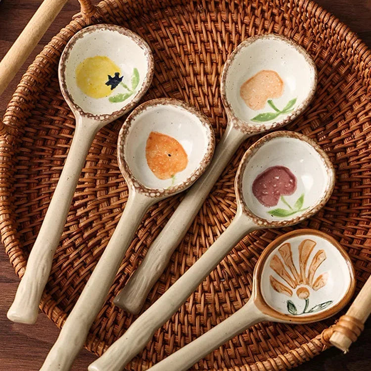 Five fruit designed ceramic kawaii spoons on a table