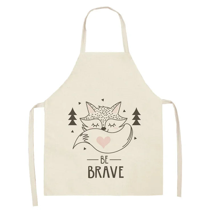 Beige kawaii apron with fox design and 'Be Brave' text on a white background