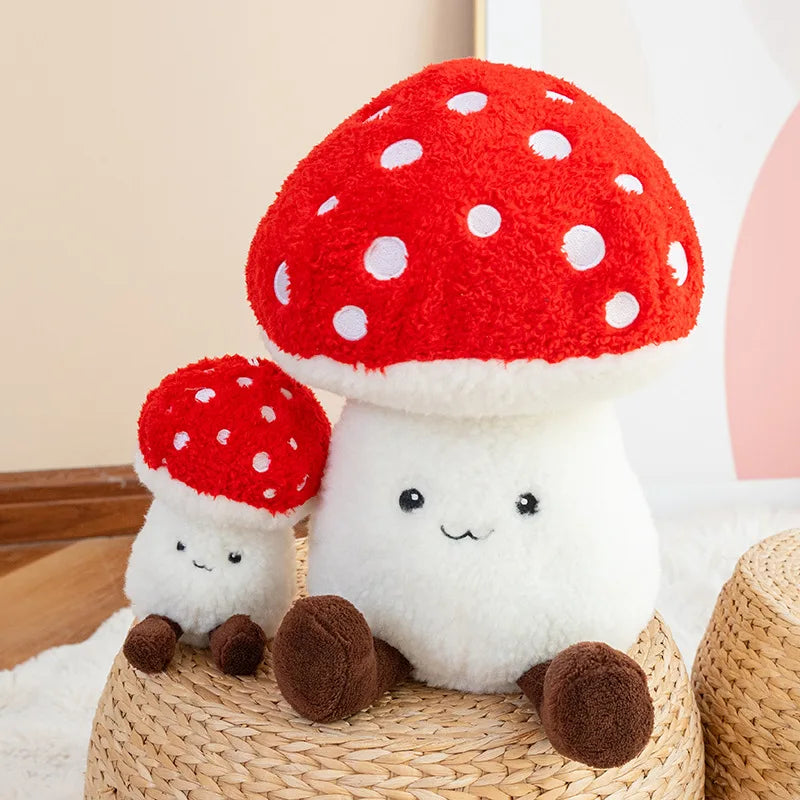 Two cute kawaii plush mushroom toys sitting on a woven stool.