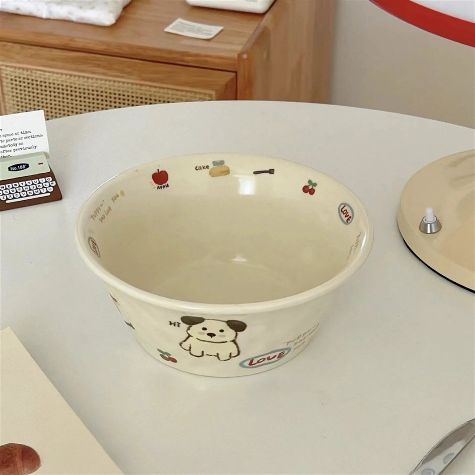 Beige ceramic kawaii ramen bowl with cartoon designs on a white surface